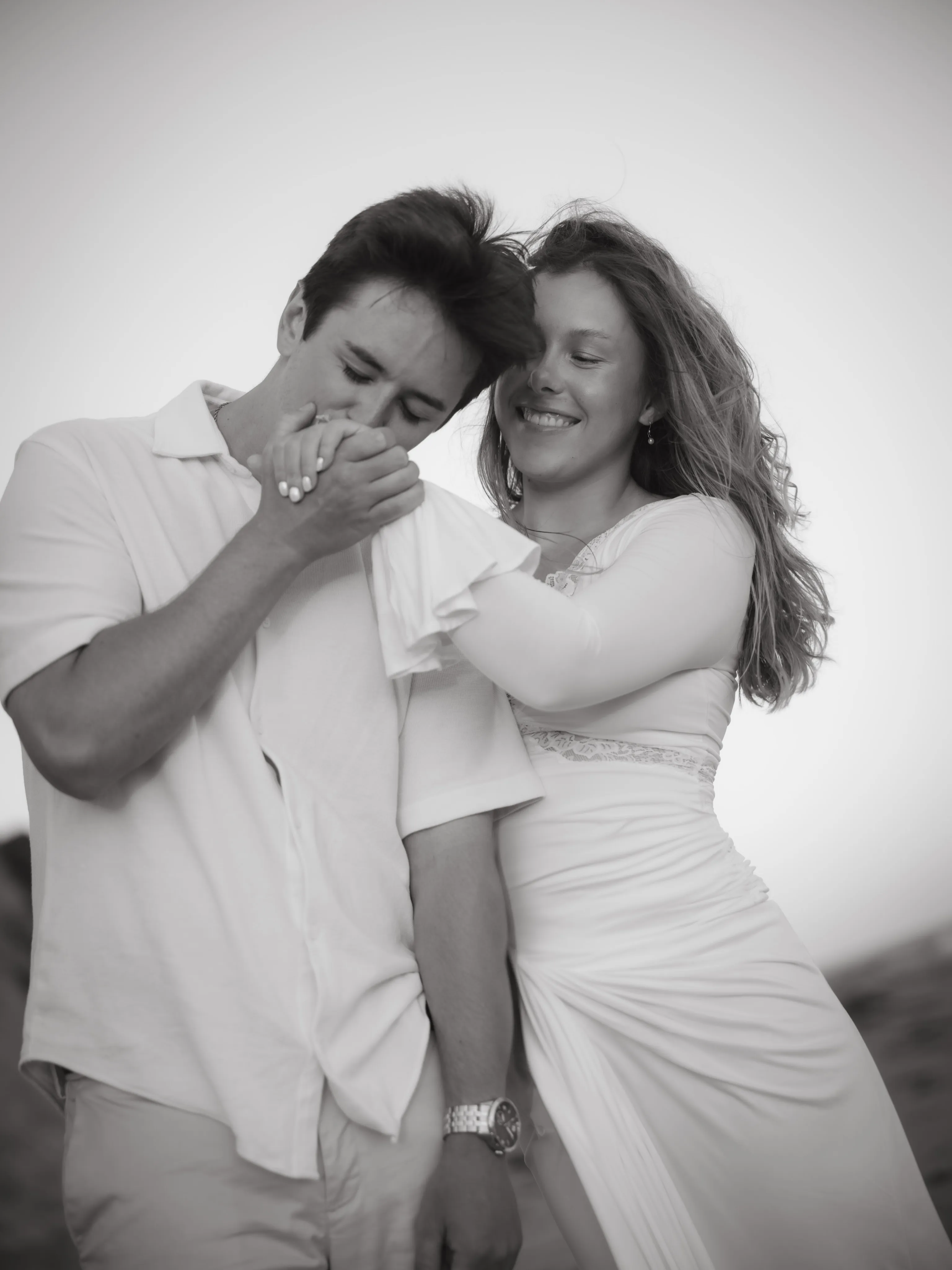 Couple laughing together in black and white