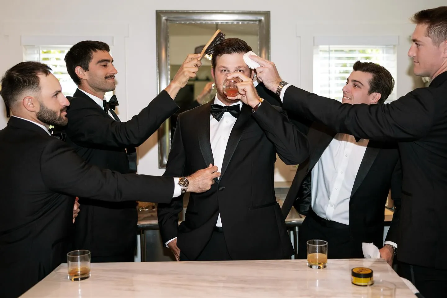 Groomsmen raising a toast before the ceremony